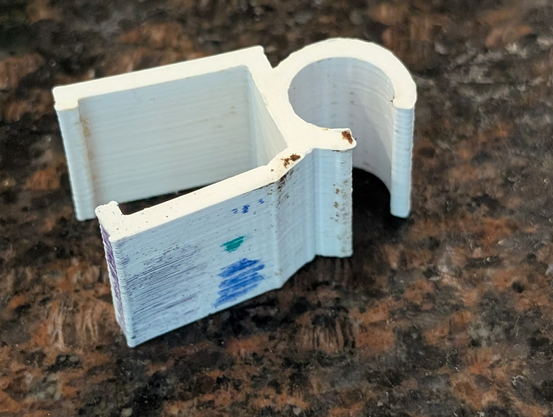 9-year-old PLA clip, starting to stretch out, marked with many markers