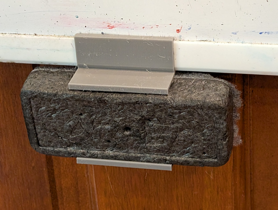 Eraser clip holding eraser