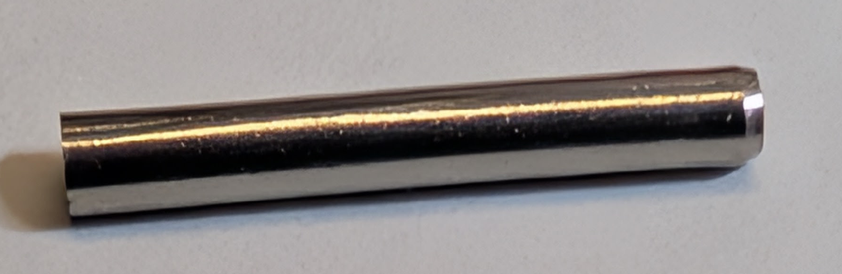 close-up view of roll pin. Only one end is tapered, and the pin is not straight.