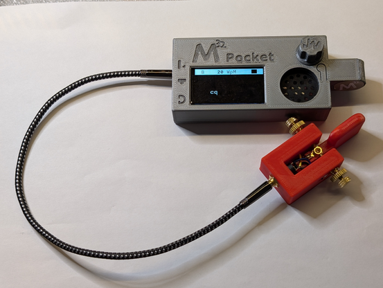 The print-in-place morse code key connected to an M32 Pocket Morserino set in decoding mode. The Morserino has just decoded "cq" sent with this key.