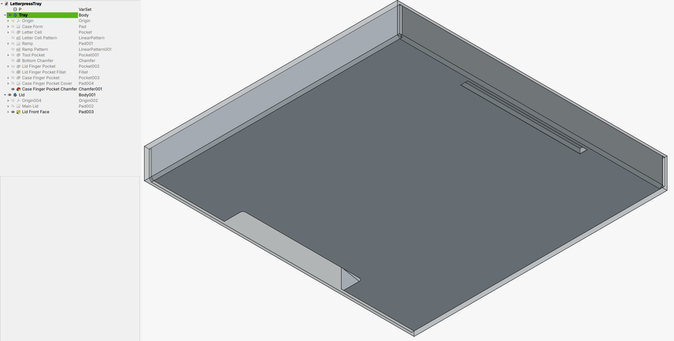Bottom view of typecase with transparent view of lid. At the front is a large cutout to pull the lid off. At the back is a small fingernail slot to hold the case while pulling off the lid.